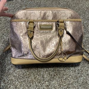 Calvin Klein CK print rose gold pink metallic tan neutral purse bag satchel
